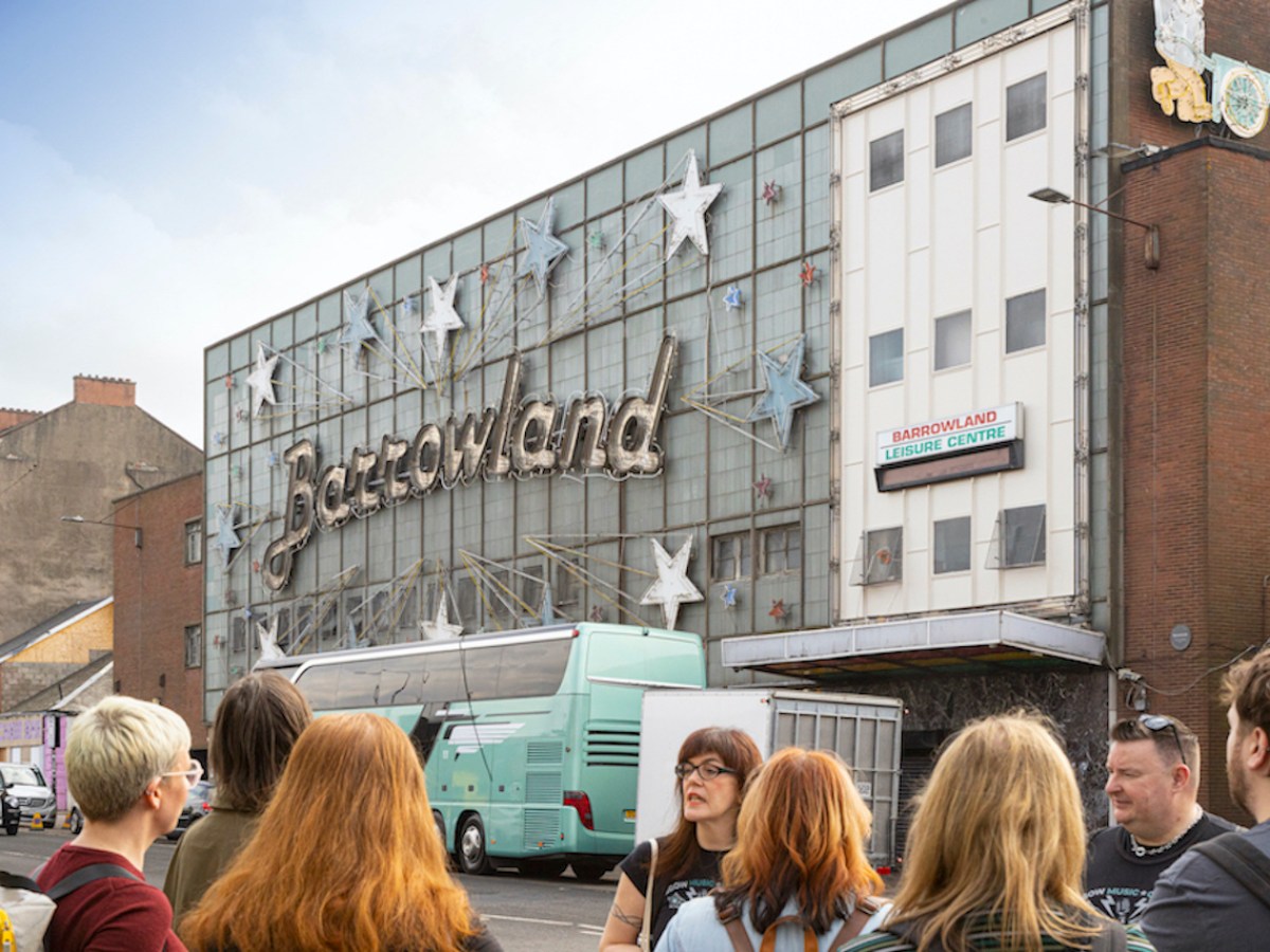 a group of people standing in front of a building