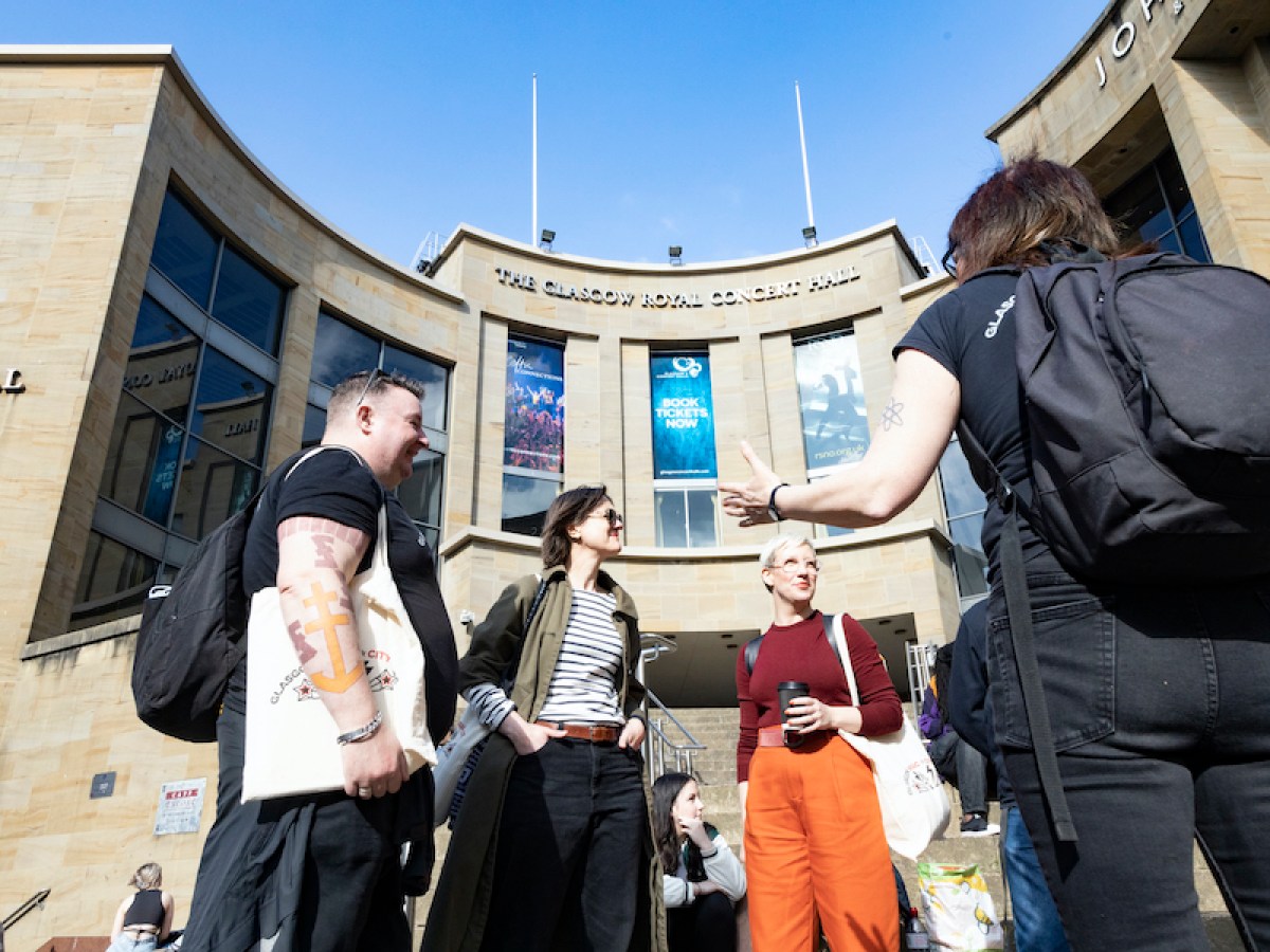a group of people standing in front of a building