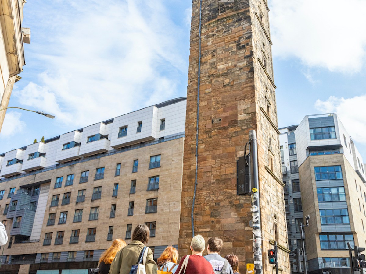 a group of people standing in front of a building