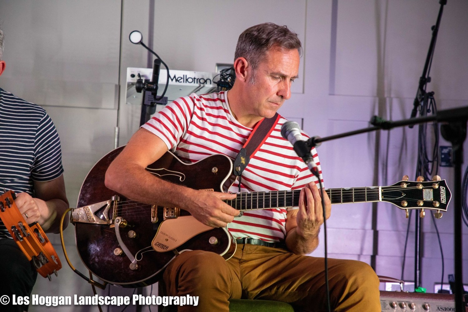 a man holding a guitar